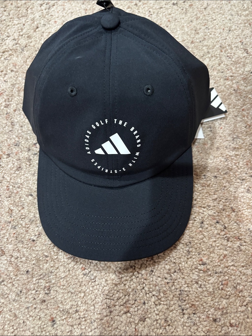 adidas ladies Black Cap with White Circular Logo crisscross back for ponytail.